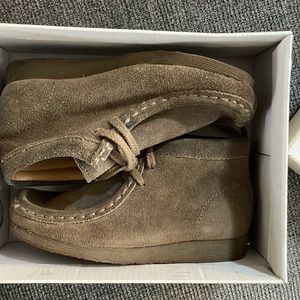 Taupe distressed colored wallabies.